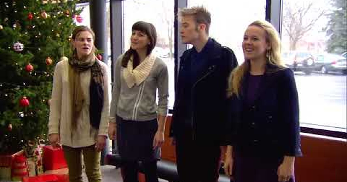 four people singing